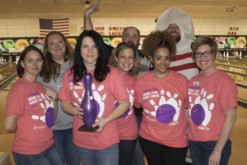 a group of women at a bowling alley